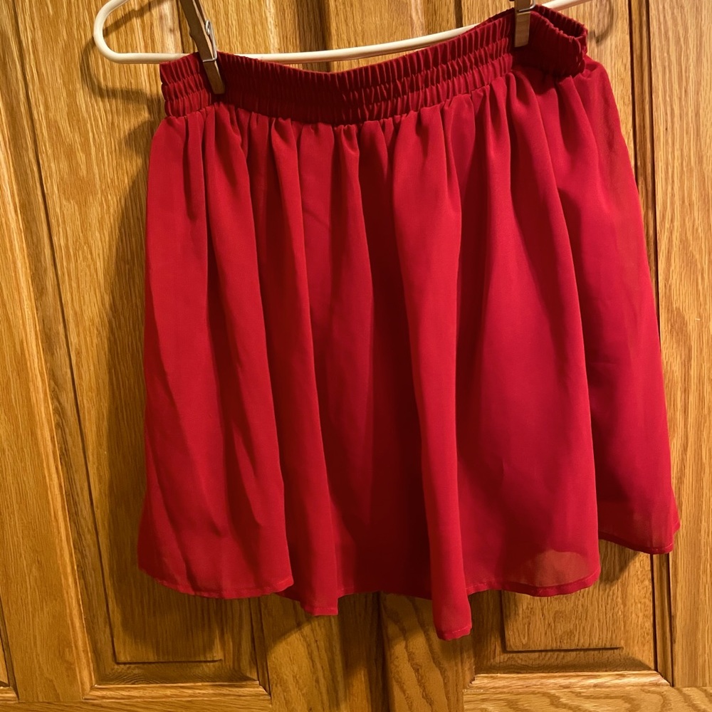Red skater girl skirt. Sheer overlay with satin like slip. Near new.